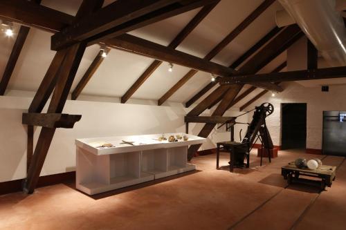 a room with a large white table in a attic at Parador Casa Da Insua in Penalva do Castelo