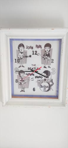 a frame with a picture of a cartoon on it at Prau Riu Hotel Hyundai-Asturdai in Llanes