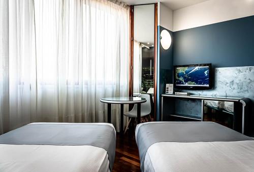 Кровать или кровати в номере Business Hotel