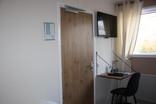 TV a/nebo společenská místnost v ubytování Maison Bellefleur B&B - Pension