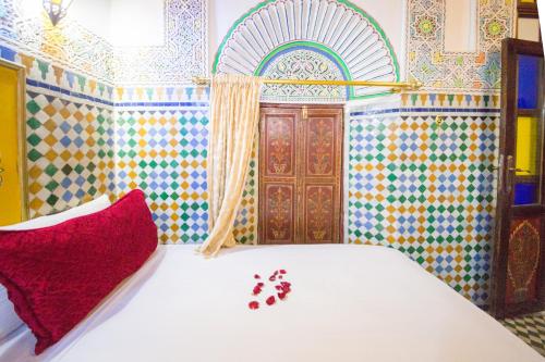 Ένα ή περισσότερα κρεβάτια σε δωμάτιο στο Riad El Bacha
