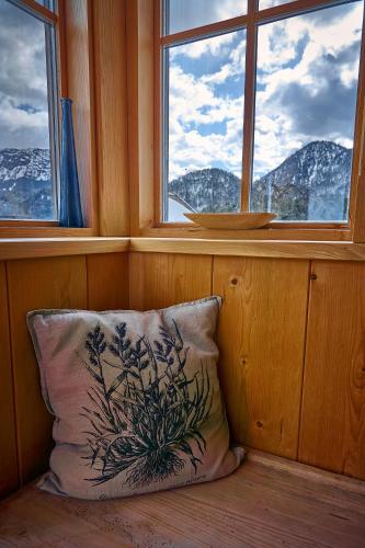 a pillow sitting in a room with a window at Ferienhaus Pucher in Grundlsee