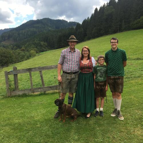 a family posing for a picture with a dog at Apartment Peterl in Alpl