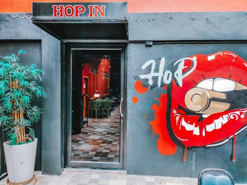 a shop with a painting on the side of the door at The Harbour Front Hotel in Suratthani