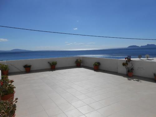 a balcony with a view of the ocean at Nikos Place in Agia Galini