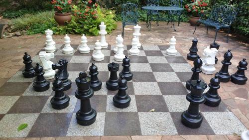 a giant chessboard on a patio at Spa Residence Carbona 101, 307 Apartman in Hévíz