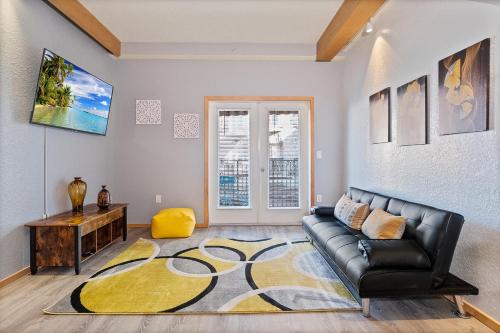 a living room with a couch and a table at Couples Getaway - Sweet Retreat - European Village Best Location in Palm Coast
