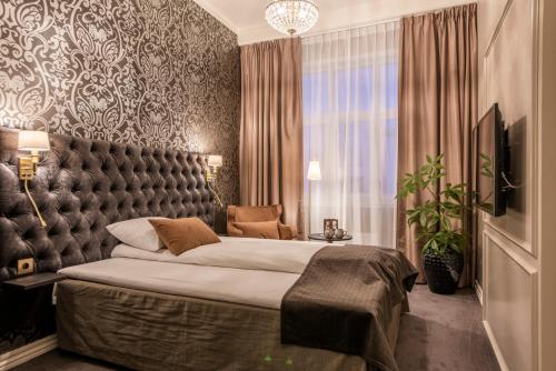 Krevet ili kreveti u jedinici u okviru objekta Clarion Collection Hotel Grand, Gjøvik