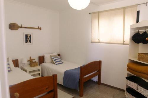 Giường trong phòng chung tại Casa Azul - Ocean View