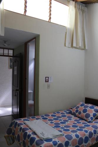 Postel nebo postele na pokoji v ubytování Hostal Isla Señorial