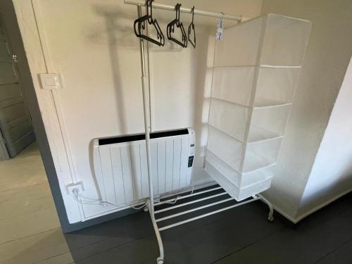 a room with a white refrigerator and shelves at Casa Tania in Ligonde