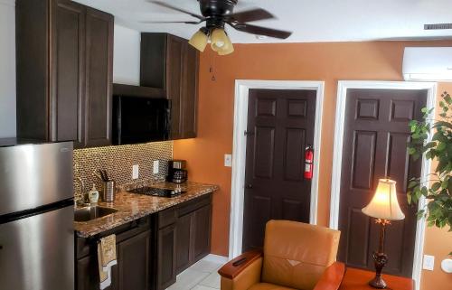 a kitchen with a sink and a refrigerator at Stylish Suite Tampa Minutes to Hard Rock Casino in Tampa