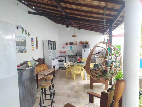 a living room with a couch and a table at Pousada Solar Encanto do Marajó in Soure