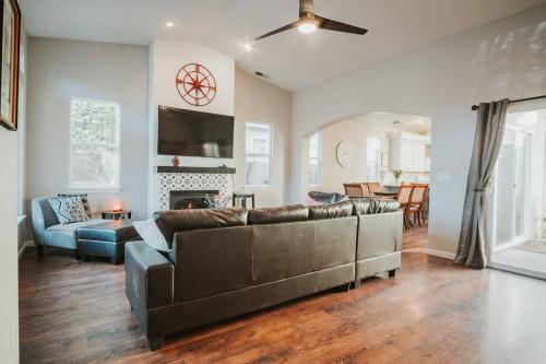 a living room with a couch and a fireplace at Central Coziness - Steps from Chico's Hub in Chico