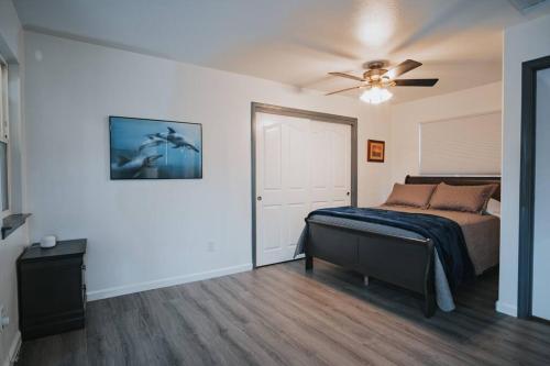 a bedroom with a bed and a ceiling fan at Gorgeous Upstairs Studio with Patio and Laundry in Chico
