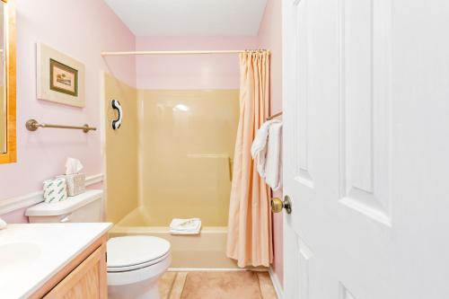 a bathroom with a toilet and a shower at Pinehurst Hideaway in Little River
