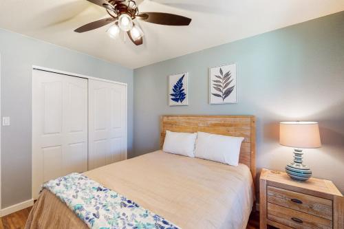 a bedroom with a bed and a ceiling fan at Everlasting Phoenix in Phoenix