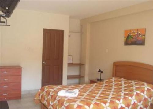 Postel nebo postele na pokoji v ubytování Hostal La Casona