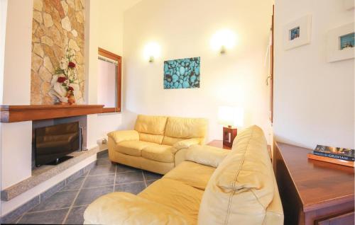 a living room with a couch and a fireplace at Beach Front Home In Ca- With Wifi in Monte Nai