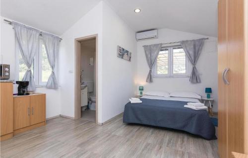 A bed or beds in a room at Cozy Home In Zadar With House Sea View