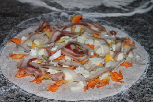 a plate of food with onions and vegetables on it at Hotel Sette E Mezzo in Castelluccio Superiore