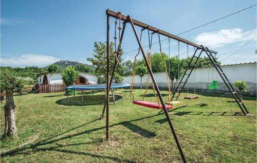 an old swing set in a yard at Gorgeous Home In Sant'angelo Romano in SantʼAngelo Romano