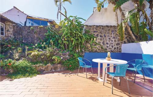a table and chairs sitting on a patio at Casa Los Pinos in Icod de los Vinos