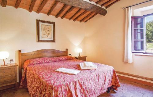 a bedroom with a bed with two towels on it at Sangiovese 4 in San Donato in Poggio