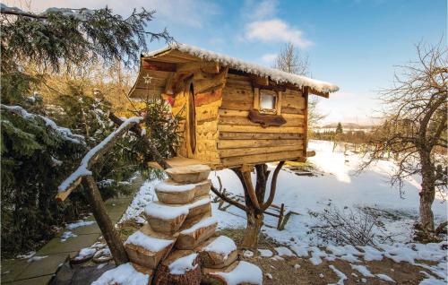 a wooden bird house with snow on it at 3 Bedroom Nice Home In Moravice in Moravice