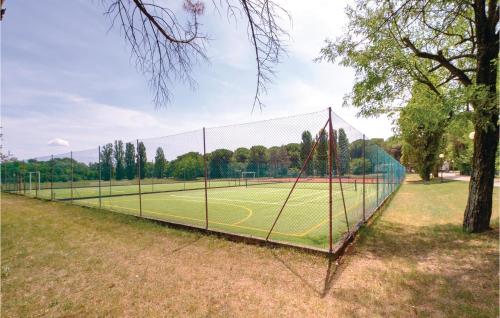 a net on a tennis court in a park at Novamiramare 1 in Belvedere
