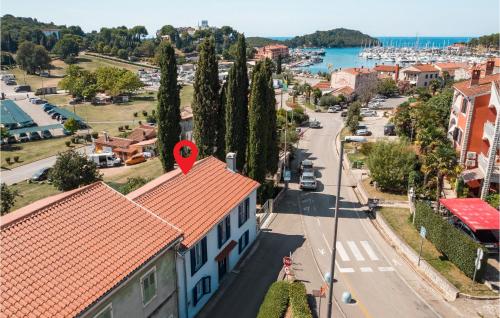 a town with a red heart on top of a building at Four-Bedroom Holiday Home In Vrsar in Vrsar