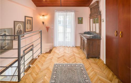 a room with a staircase and a sink and a mirror at Four-Bedroom Holiday Home In Vrsar in Vrsar