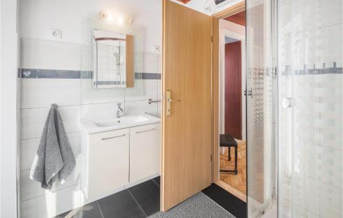 a bathroom with a sink and a mirror at Four-Bedroom Holiday Home In Vrsar in Vrsar