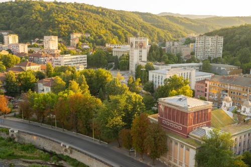 an aerial view of a city with trees and a road at Adriano’s studio Gabrovo in Gabrovo