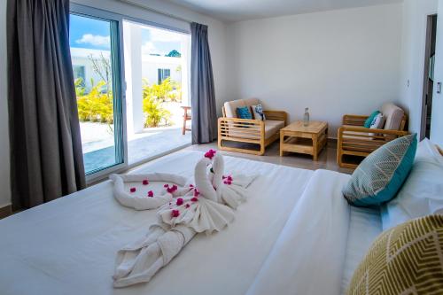 Кровать или кровати в номере You&Me Resort