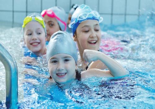 a group of young girls in a swimming pool at شقق ارين المطار in Jeddah