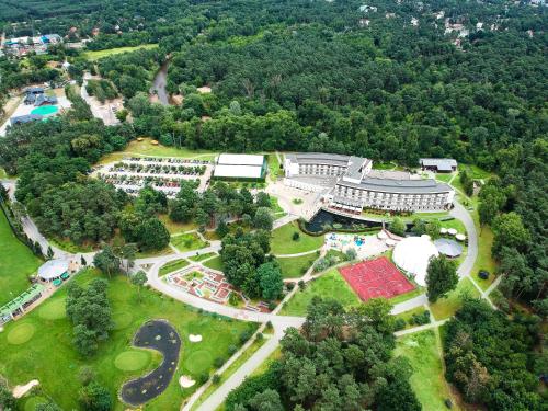 an aerial view of a park with a building at Holiday Inn Resort Warsaw Józefów, an IHG Hotel in Józefów