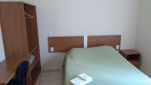 Ένα ή περισσότερα κρεβάτια σε δωμάτιο στο Hotel Paulista