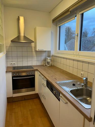 a kitchen with a sink and a counter top at Tinschert Hotel-Restaurant-Partyservice in Schwertberg