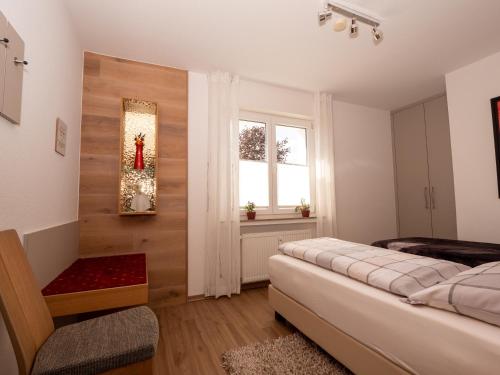 a bedroom with a bed and a window at Fewo Papst Nordborchen in Nordborchen
