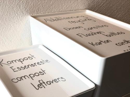 a white box with writing on the side of it at Wonderful & Private Room with en-suite bathroom in Triesenberg