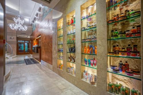 a pharmacy hallway with shelves of food at Farmona Hotel Business & SPA in Kraków