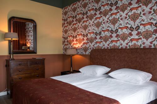 Postel nebo postele na pokoji v ubytování Hotel Bakker