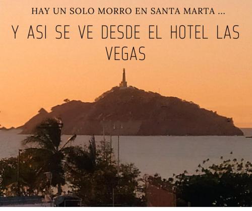 a picture of a island in the water with a lighthouse at Hotel Las Vegas by CMS hotels in Santa Marta