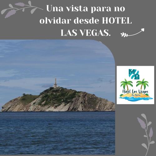 a cross on top of an island in the ocean at Hotel Las Vegas by CMS hotels in Santa Marta