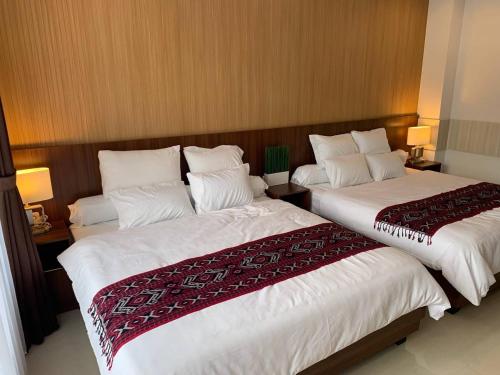 Ein Bett oder Betten in einem Zimmer der Unterkunft Platinum Dago Resort villa 15px Private Pool Bandung