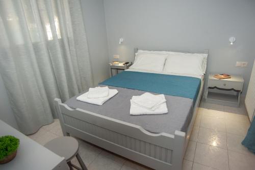 Ένα ή περισσότερα κρεβάτια σε δωμάτιο στο Vivian Villa