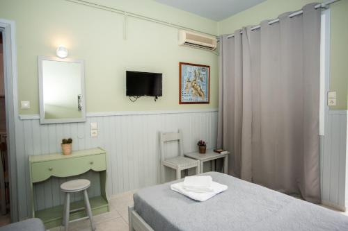Ένα ή περισσότερα κρεβάτια σε δωμάτιο στο Vivian Villa