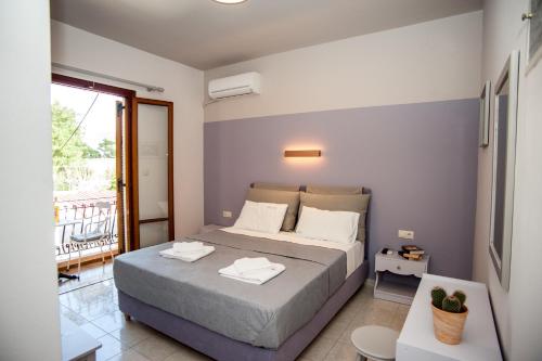 Ένα ή περισσότερα κρεβάτια σε δωμάτιο στο Vivian Villa