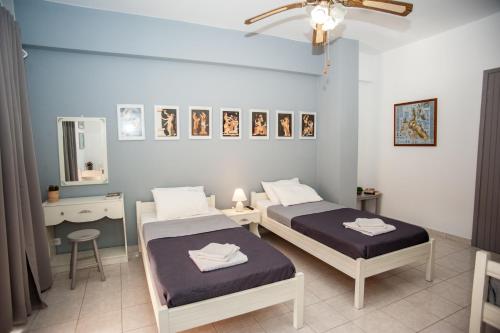 Ένα ή περισσότερα κρεβάτια σε δωμάτιο στο Vivian Villa